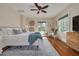 Cozy bedroom with hardwood floors, a ceiling fan, and ample natural light at 620 26Th N Ave, St Petersburg, FL 33704