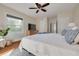 Main bedroom with hardwood floors, a ceiling fan, and a walk-in closet at 620 26Th N Ave, St Petersburg, FL 33704