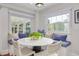 Kitchen breakfast nook with white table and built in bench seating at 620 26Th N Ave, St Petersburg, FL 33704