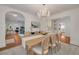 Bright dining room featuring a large wooden table and a crystal chandelier at 620 26Th N Ave, St Petersburg, FL 33704