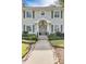 Front entrance of a house with gray door and walkway at 620 26Th N Ave, St Petersburg, FL 33704