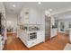 Open concept kitchen with stainless steel appliances and white shaker cabinets at 620 26Th N Ave, St Petersburg, FL 33704