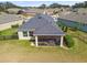 Home's backyard with screened patio and fence at 6230 Plover Meadow St, Lithia, FL 33547