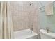 Clean bathroom with bathtub, shower, and tile surround at 6230 Plover Meadow St, Lithia, FL 33547