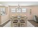 Bright dining room with a farmhouse table and chandelier at 6230 Plover Meadow St, Lithia, FL 33547