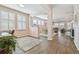 Open concept dining room with hardwood floors and view to living room at 6230 Plover Meadow St, Lithia, FL 33547