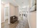 Open concept entryway leading to living room and bathroom at 6230 Plover Meadow St, Lithia, FL 33547