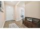 Bright and airy entryway with wood flooring and storage bench at 6230 Plover Meadow St, Lithia, FL 33547