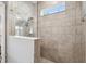 Walk-in shower with glass enclosure and tile surround at 6230 Plover Meadow St, Lithia, FL 33547