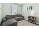 Comfortable sitting room featuring gray sectional sofa at 6230 Plover Meadow St, Lithia, FL 33547