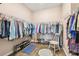 Spacious walk-in closet with ample hanging space and shelving at 6230 Plover Meadow St, Lithia, FL 33547