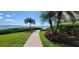 Landscaped walkway leading to waterfront access at 6322 Palma Del Mar S Blvd # 401, Tierra Verde, FL 33715