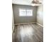 Bedroom with ceiling fan and grey walls at 7947 Radcliffe Cir, Port Richey, FL 34668