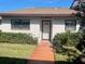 Front view of a house with a walkway leading to the entrance at 7947 Radcliffe Cir, Port Richey, FL 34668