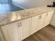 White cabinets and granite countertops at 7947 Radcliffe Cir, Port Richey, FL 34668