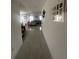 Clean hallway with tile floor leading to living room at 8303 Begonia St, Spring Hill, FL 34608