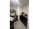 Laundry room with washer, dryer, and shelving unit at 8303 Begonia St, Spring Hill, FL 34608