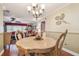 Bright dining room with a wooden table and chandelier at 9548 141St St, Seminole, FL 33776