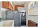 Convenient laundry room with washer, dryer, and cabinets at 9548 141St St, Seminole, FL 33776