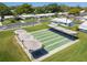 Well-maintained shuffleboard courts with covered seating areas at 9548 141St St, Seminole, FL 33776