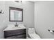 Modern bathroom with white vanity and gray walls at 1010 Emerald Creek Dr, Valrico, FL 33596