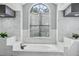 Luxury bathroom with a free-standing tub and marble finishes at 1010 Emerald Creek Dr, Valrico, FL 33596