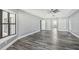 Large bedroom with wood-look floors and ample natural light at 1010 Emerald Creek Dr, Valrico, FL 33596