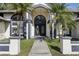 House entrance with double doors and landscaping at 1010 Emerald Creek Dr, Valrico, FL 33596