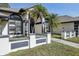 Elegant entryway with double doors and landscaping at 1010 Emerald Creek Dr, Valrico, FL 33596