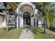 Elegant house entrance featuring double doors and landscaping at 1010 Emerald Creek Dr, Valrico, FL 33596