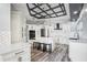 Spacious kitchen featuring white cabinets, an island, and stylish lighting at 1010 Emerald Creek Dr, Valrico, FL 33596