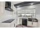 Modern kitchen with farmhouse sink, stainless steel appliances, and white cabinets at 1010 Emerald Creek Dr, Valrico, FL 33596