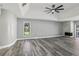 Living room with hardwood floors, fireplace and large window at 1010 Emerald Creek Dr, Valrico, FL 33596