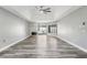 Bright living room with vaulted ceiling, fireplace, and sliding doors to the pool at 1010 Emerald Creek Dr, Valrico, FL 33596