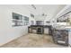 Outdoor kitchen with stainless steel appliances and stone countertops at 1010 Emerald Creek Dr, Valrico, FL 33596