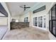 Outdoor kitchen with stone veneer and patio doors at 1010 Emerald Creek Dr, Valrico, FL 33596