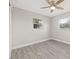 Bright bedroom with ceiling fan, new flooring, and ample closet space at 11395 83Rd Ave, Seminole, FL 33772