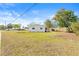 Front view of updated house with landscaping and large yard at 11395 83Rd Ave, Seminole, FL 33772