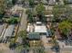 Overhead aerial view of a residential property featuring a house, parking area, and a recreational vehicle at 1215 E Holland Ave, Tampa, FL 33612