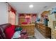 Bedroom features wood furniture and red decorations at 1215 E Holland Ave, Tampa, FL 33612