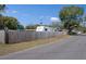 Street view showing wood fence and recreational vehicle parked behind a house in a residential area at 1215 E Holland Ave, Tampa, FL 33612