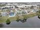 Aerial view of canal-front house and pool at 12391 70Th St, Largo, FL 33773