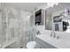 Modern bathroom with gray vanity and a walk-in shower at 12391 70Th St, Largo, FL 33773