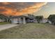 House exterior at sunset with landscaping at 12391 70Th St, Largo, FL 33773