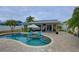 Large kidney shaped pool with patio and covered lanai at 12391 70Th St, Largo, FL 33773