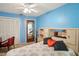 Bright bedroom with a floral bedspread and built-in shelving at 12433 Shadow Ridge Blvd, Hudson, FL 34669