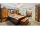 Bedroom with king-size bed, wooden furniture and access to an office at 12433 Shadow Ridge Blvd, Hudson, FL 34669