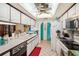 View of kitchen with appliances, cabinetry, and breakfast bar at 12433 Shadow Ridge Blvd, Hudson, FL 34669