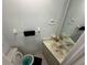 Small half bathroom with a single sink and toilet at 13909 Fletchers Mill Dr, Tampa, FL 33613