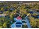 Aerial view showcasing home with pool and solar panels at 14311 83Rd Pl, Seminole, FL 33776